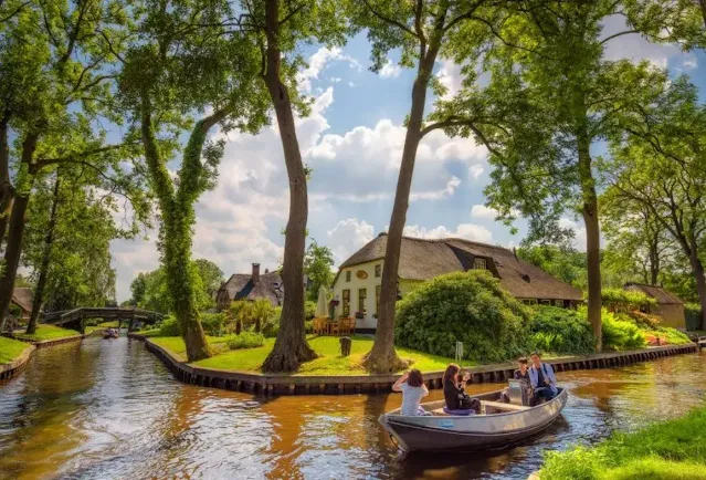 A family enjoying on boat ride in Giethoorn