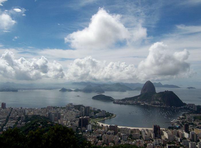 Sugarloaf Mountain, is a peak situated in Rio de Janeiro, Brazil, at the mouth of Guanabara Bay on a peninsula that sticks out into the Atlantic Ocean. Rising 396 metres (1,299 ft) above the harbor, its name is said to refer to its resemblance to the traditional shape of concentrated refined loaf sugar.