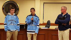 2 of the 4 team captains helped present the full team to the School Committee assisted by Coach Spillane