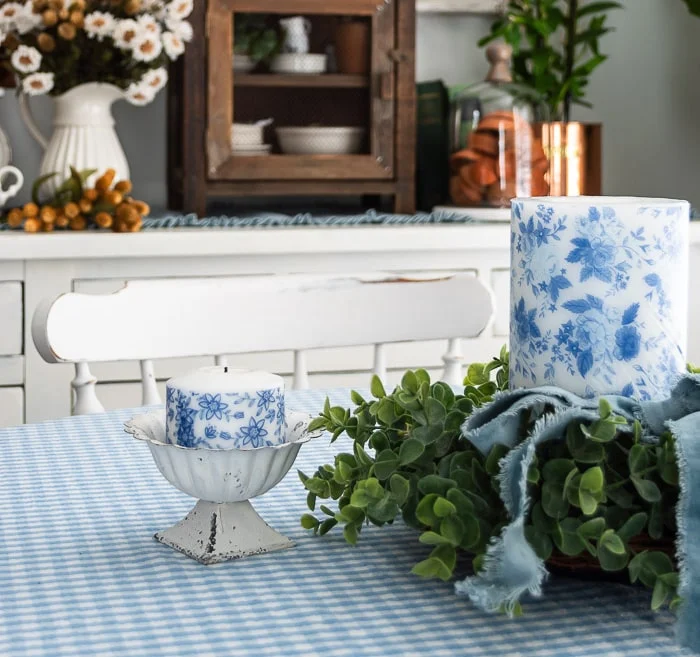 blue and white candles, gingham tablecloth, greenery