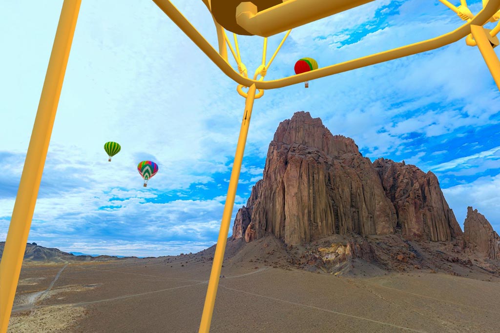 360 degree photo of Shiprock in New Mexico with a superimposed cartoon image of a hot air balloon