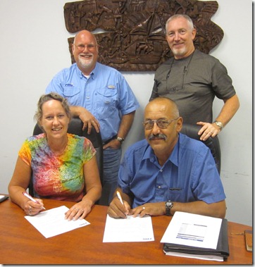 Harvies signing commitment papers 2 cropped