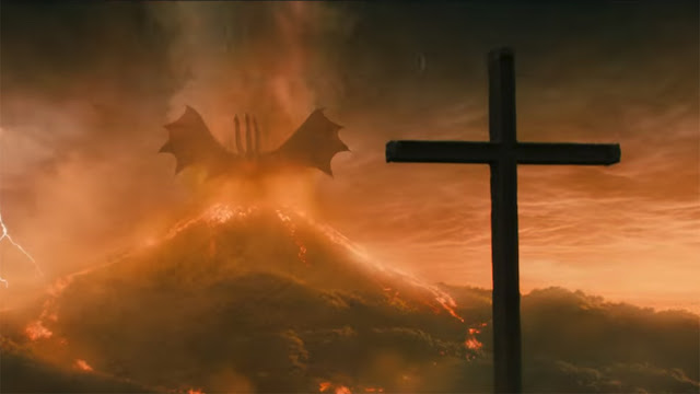 giant monster, volcano, and a cross