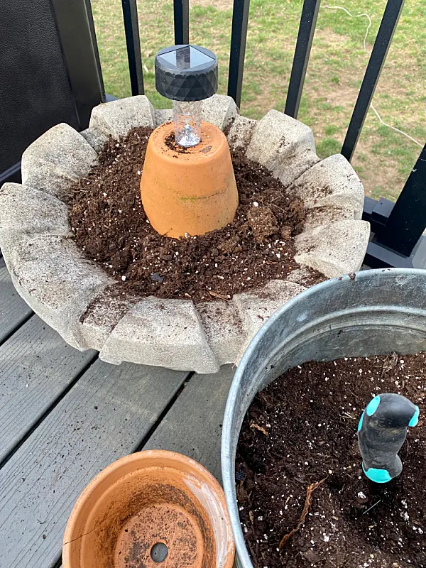 planter with a pot and solar light
