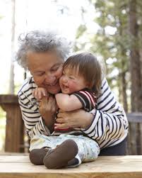 grandmother hugging grandchildren