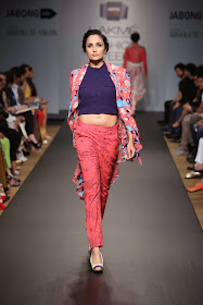 Asymmetrical cuts helped balance out the bold hues and added a whimsical touch to each piece. Kurti-dresses, tunics, jackets, tops and pants were the elegantly draped in fabrics like crepe, organza and sheer material and sported several prints both solid as well as see-through in the form of flowers and geometric designs.