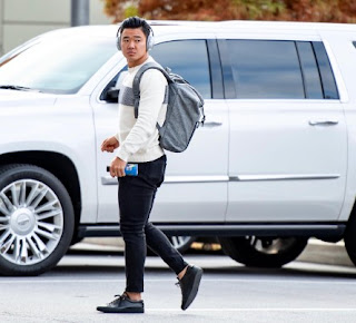 Picture of Younghoe Koo while the car in the background