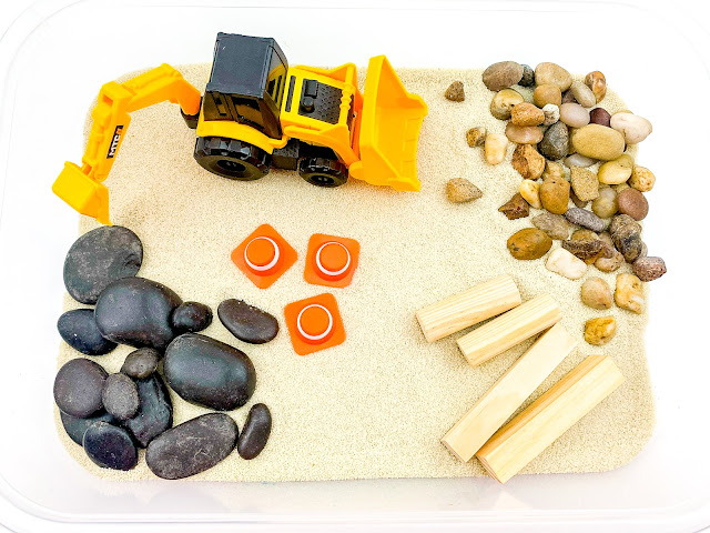 Construction site sensory bin with kinetic sand fill. Build, truck, pile,  stack, move and drive all around the…