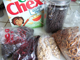 snack mix ingredients:  Chex, dark chocolate chips, pretzel twists, raisins, dried cranberries, peanuts