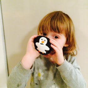 Having fun motor skills practice making penguin cupcakes