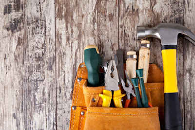 Carpentry tools are pictured on a wood platform