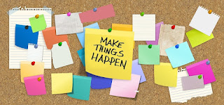 Bulletin board with multiple colorful sticky notes. The center sticky note says Make Things Happen