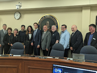 Congressman Auchincloss poses with Town Council, Town Administrator, and Town Clerk