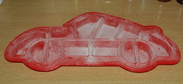 cars cake mold. Fill cells of mould with cake