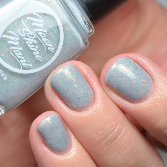 grey nail polish with flakies swatch