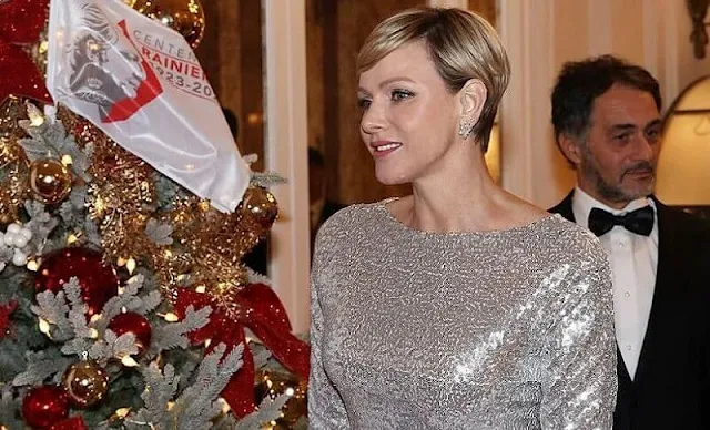 Princess Charlene wore a metallic embroidery sequined gown by Akris. Diamond flower earrings by Dior