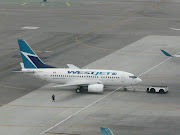 A WestJet B737600 next to an AeroMexico B737700; the 600 is 8 feet .