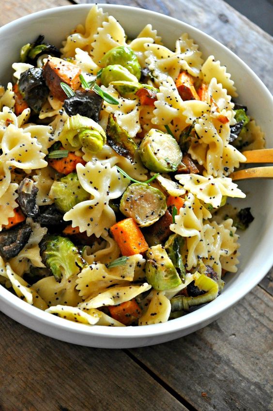 Roasted Fall veggies, tossed with pasta and the most amazing vegan creamy poppy seed dressing!