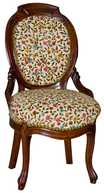 A Victorial walnut chair with round carved back and hand-worked crewel fabric in a floral pattern.