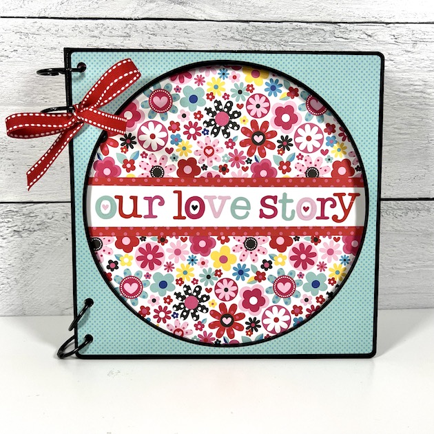 Our Love Story Scrapbook Album with flowers and a circle window on the cover