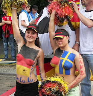 Topless body-painted female football fans at World Cup in Germany