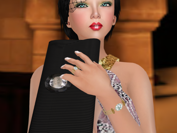 Accessories featuring a clutch, gold crystal bracelet and ring.