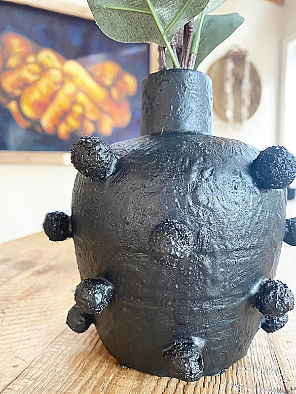 black textured vase on table