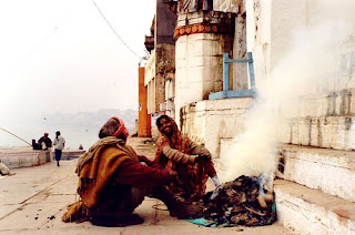 An man and woman, comfortable and warm on a cold winter day. Varanasi (Benares), India. Flickr photo by Ahron de Leeuw