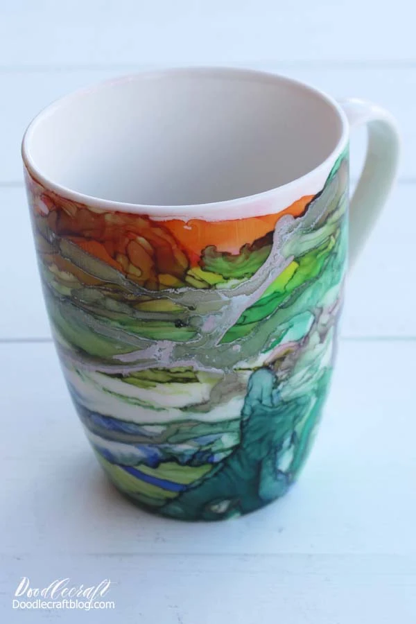 Use Alcohol inks to create a stunning work of abstract art on a ceramic mug for the perfect holiday gift. With full video tutorial instructions too!