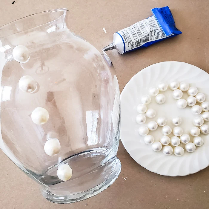 glue beads in rows onto glass vase