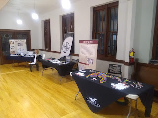 tables and posters arranged around hall