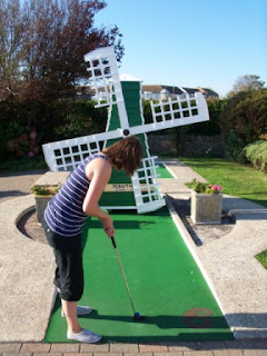 Emily playing the Windmill hole at Bognor Regis Mini Golf