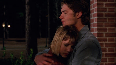 CJ holding Jen tightly as she hugs him for comfort