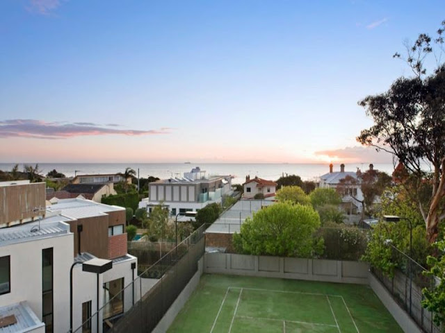 Photo of backyard and the ocean as seen from the roof 