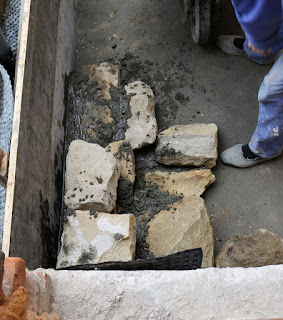 Stones being used to build up the base for the steps