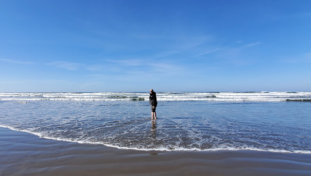 Joel's feet on the water enjoying the nice sunny day in Seaside