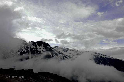 Snow covered Hills on the way from Manali to Rohtang, Himachal Pradesh, INDIA: Rohtang pass provides a natural divide between the sub-humid/humid Kullu Valley with a primarily Hindu culture (in the south), and the arid/semi-arid high-altitude Lahaul and Spiti valleys with a Buddhist culture (in the north). rotang pass lies on the watershed between the Chenab and Beas Basins. On the southern side of this pass, the Beas River emerges from underground and flows southward and on its northern side, the Chandra River, a source stream of the river Chenab, flows westward.Posted by Ripple (VJ) on PHOTO JOURNEY through www.travellingcamera.com @ www.travellingcamera.com : ripple, Vijay Kumar Sharma, ripple4photography, Frozen Moments, photographs, Photography, ripple (VJ), VJ, Ripple (VJ) Photography, Capture Present for Future, Freeze Present for Future, ripple (VJ) Photographs , VJ Photographs, Ripple (VJ) Photography : View of Rani Nala @ 40 Km from Manali.Rohtang pass was ancient trade route between the people on either side of Pir Panjal. The local name for Rohtang pass is a generic name of pass. There are many other passes in Lahoul and Spitti which have specific names (Kunzom La, Bara Lachala n so on). This is suggestive of the fact that this must have been the oldest and most frequented pass in the region, or the fact that it is the main pass leading from one cultural region (Indian) to another, quite different one, to the north.