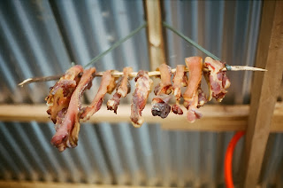 Pork being hanged and processed to become etag