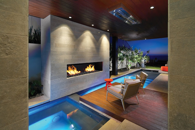 Picture of the outdoor fireplace by the swimming pool