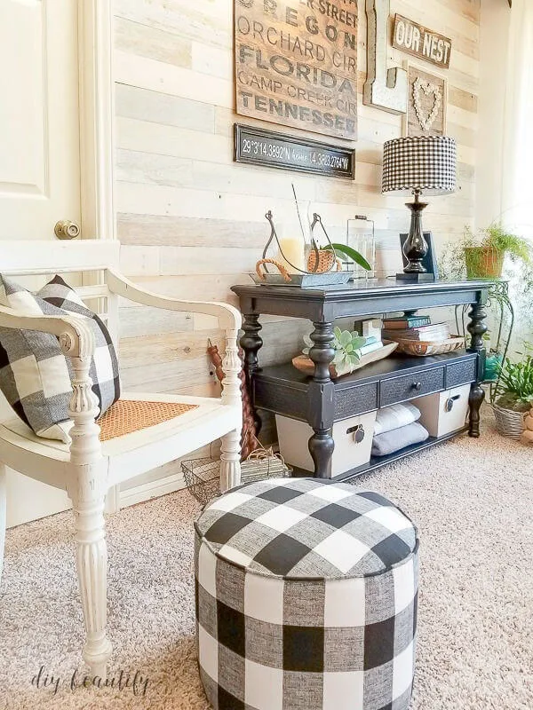 gallery wall and black and white buffalo plaid ottoman