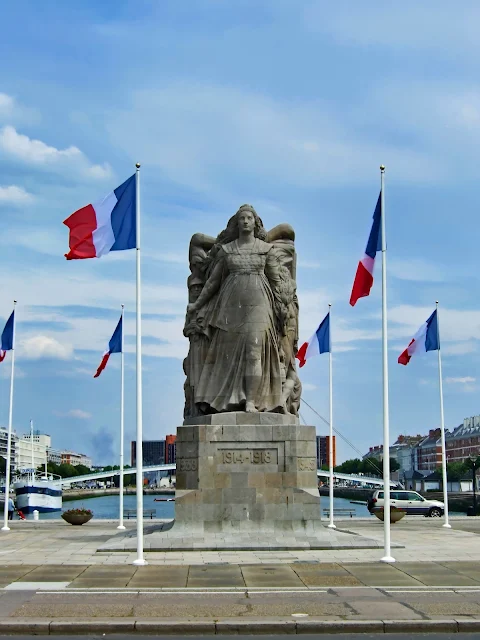 Monument aux Morts in Le Havre, surrounded by French Flags