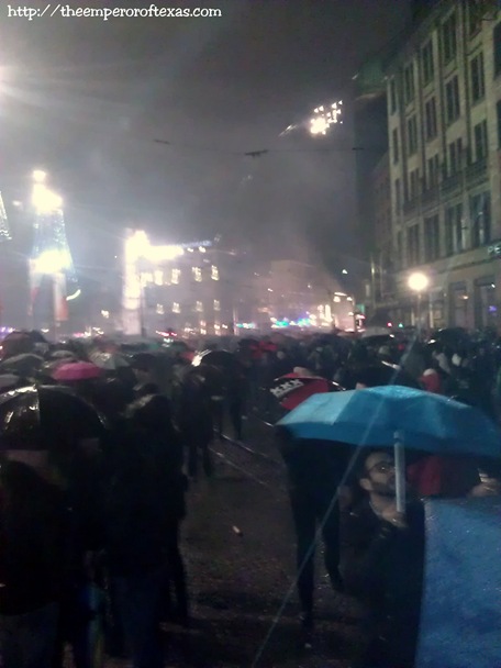 Dam Square. 15 minutes after THE NEW YEAR 2013(LIVE caption delivered to Fb: “Quite a crowd present. Broken glass sound rinkeling and endless fireworks still heard 15 minutes after NEW YEAR.”)
