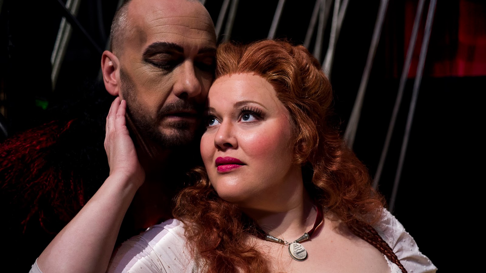 IN PERFORMANCE: Bass-baritone WAYNE TIGGES as Der Holländer (left) and soprano CHRISTINA PIER as Senta (right) in Virginia Opera's production of Richard Wagner's DER FLIEGENDE HOLLÄNDER, April 2016 [Photo by Lucid Frame Productions, © by Virginia Opera]