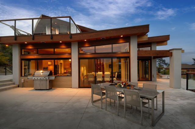 Photo of an amazing armada house as seen from the terrace with barbecue and dinning table