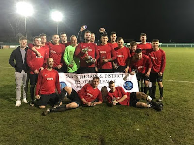 Sherpa footballers celebrating their cup final victory over Barnetby Reserves - March 2019