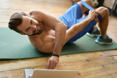 A man is exercising based on this customized workout plans by this virtual personal trainer