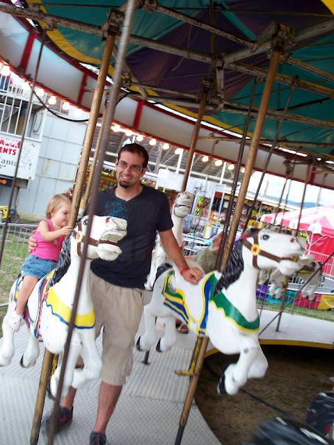 One year old on the carousel