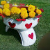 Ways-reuse-old-tires-garden-white-flower-container-red-hearts