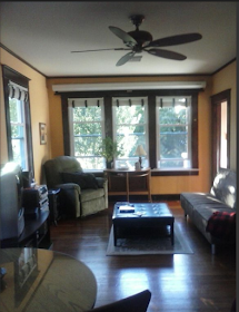 living room of red house for sale at 6658 Chester Ave Stottville NY