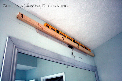 DIY Bathroom Light Fixture by Chic on a Shoestring Decorating